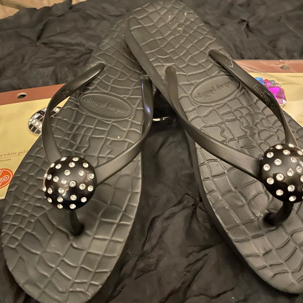 Lindsay Phillips flip flops with jewels.